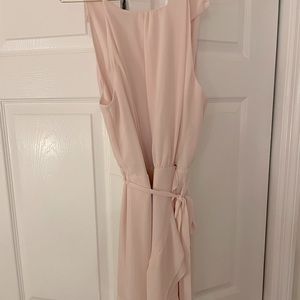 Light pink color. Ruffle sides.